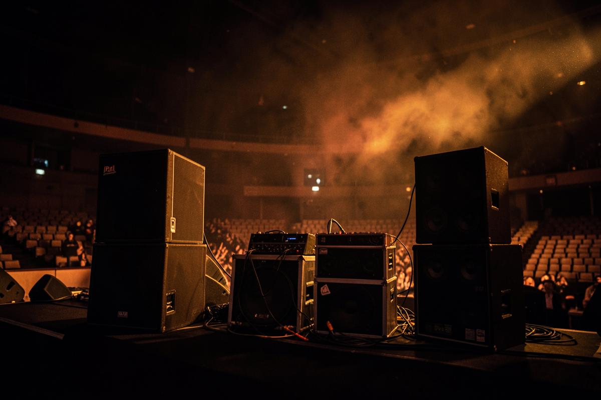 Portable PA speakers and subwoofers staged before an event